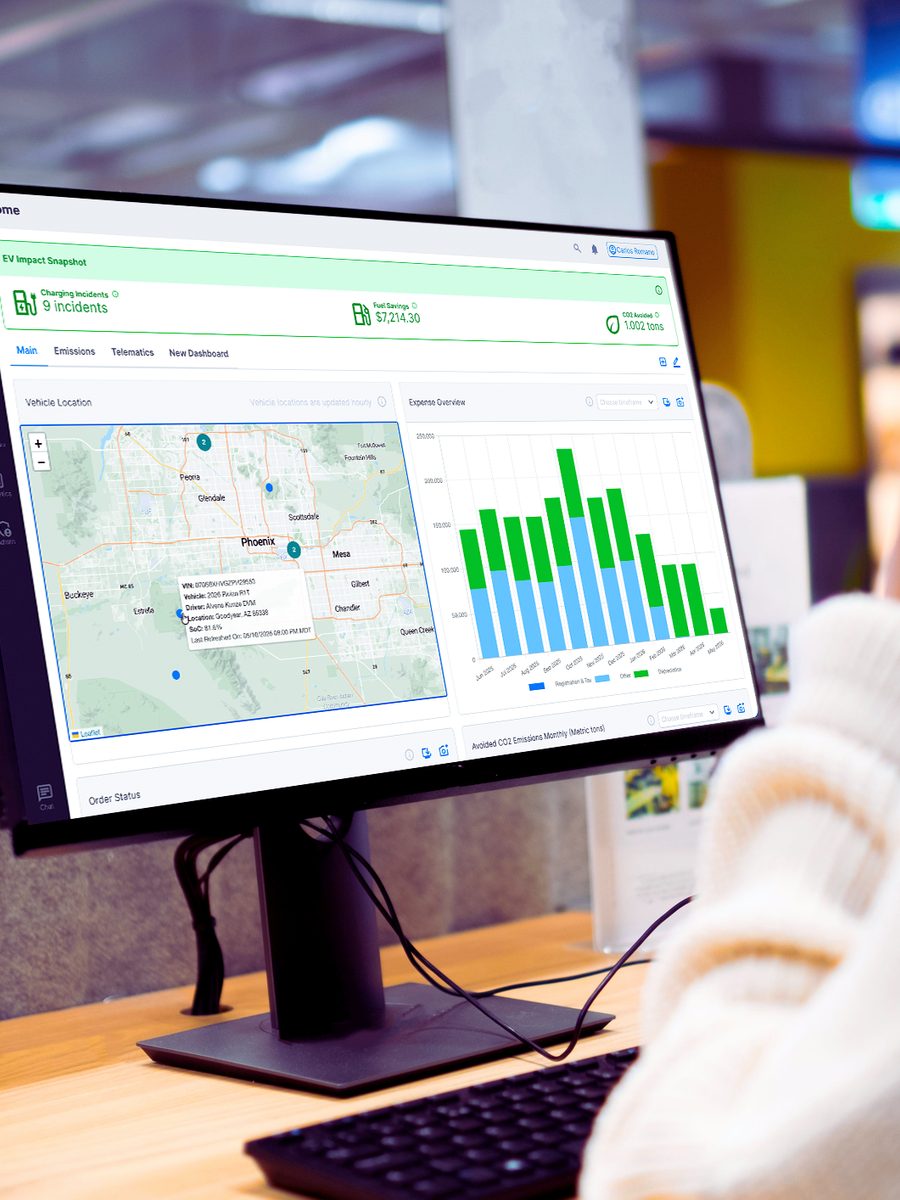 Fleet manager reviewing analytics on a desktop dashboard